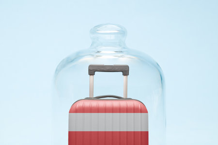 Suitcase with Austrian flag design in quarantine minimal creative coronavirus travel restriction concept.の写真素材