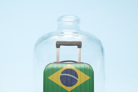 Suitcase with Brazilian flag design in quarantine minimal creative coronavirus travel restriction concept.の写真素材