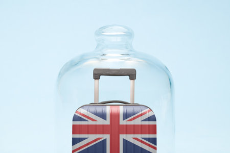 Suitcase with United Kingdom flag design in quarantine minimal creative coronavirus travel restriction concept.の写真素材