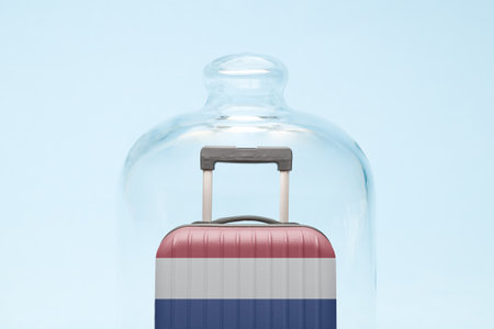 Suitcase with Netherlands flag design in quarantine minimal creative coronavirus travel restriction concept.の写真素材