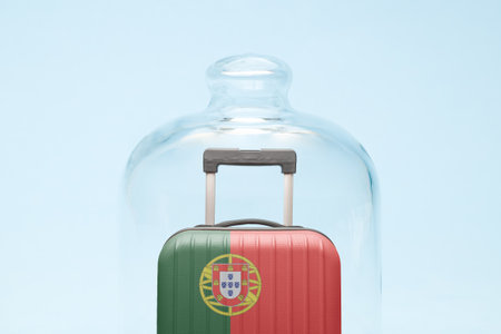 Suitcase with Portugal flag design in quarantine minimal creative coronavirus travel restriction concept.の写真素材