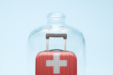 Suitcase with Switzerland flag design in quarantine minimal creative coronavirus travel restriction concept.の写真素材