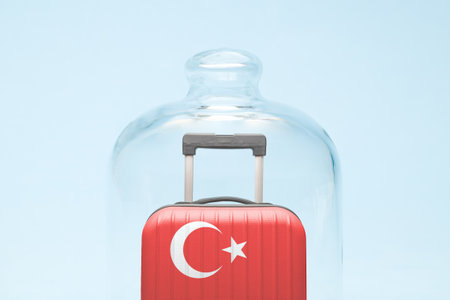 Suitcase with Turkish flag design in quarantine minimal creative coronavirus travel restriction concept.の写真素材