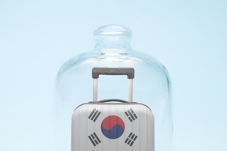 Suitcase with South korean flag design in quarantine minimal creative coronavirus travel restriction concept.の写真素材