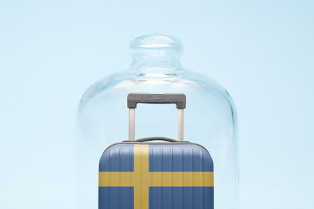 Suitcase with Sweden flag design in quarantine minimal creative coronavirus travel restriction concept.の写真素材
