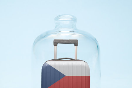Suitcase with Czech republic flag design in quarantine minimal creative coronavirus travel restriction concept.の写真素材