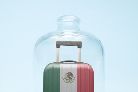 Suitcase with Mexican flag design in quarantine minimal creative coronavirus travel restriction concept.の写真素材