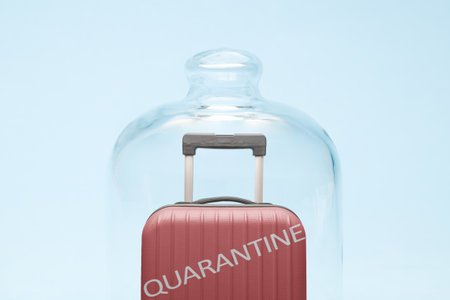 Suitcase in quarantine minimal creative coronavirus no travel concept.の写真素材