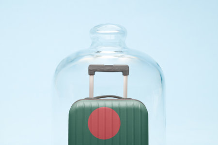 Suitcase with Bangladesh flag design in quarantine minimal creative coronavirus travel restriction concept.の写真素材