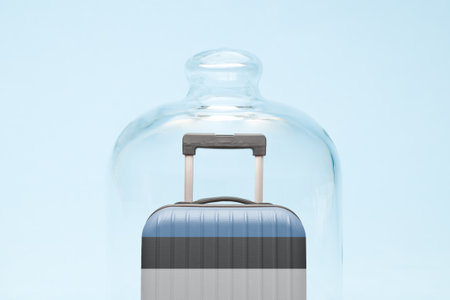 Suitcase with Estonian flag design in quarantine minimal creative coronavirus travel restriction concept.の写真素材