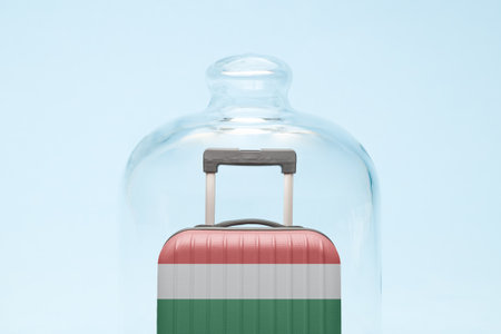 Suitcase with Hungarian flag design in quarantine minimal creative coronavirus travel restriction concept.の写真素材