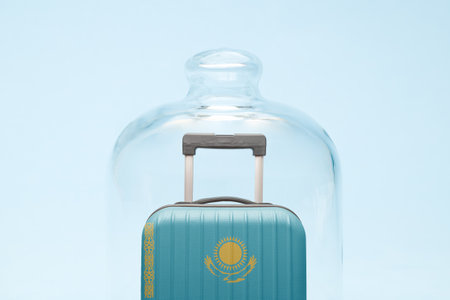 Suitcase with Kazakhstan flag design in quarantine minimal creative coronavirus travel restriction concept.の写真素材