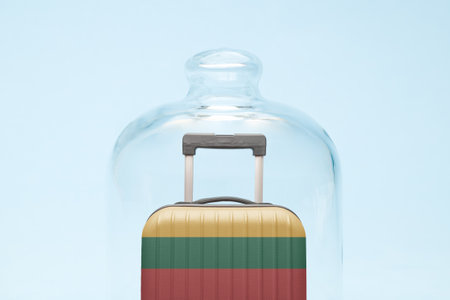 Suitcase with Lithuanian flag design in quarantine minimal creative coronavirus travel restriction concept.の写真素材