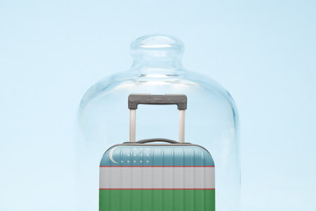 Suitcase with Uzbekistanian flag design in quarantine minimal creative coronavirus travel restriction concept.の写真素材