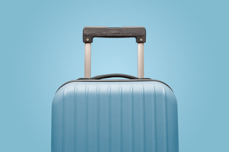 Suitcase on pastel blue background minimal creative travel conceptの写真素材