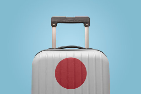 Suitcase with Japanese flag design travel Asia concept.の写真素材
