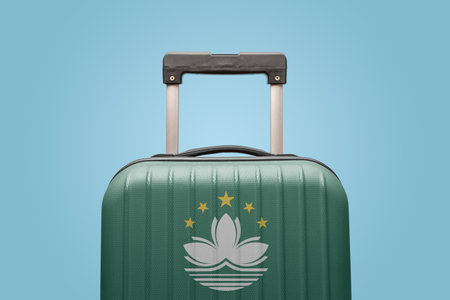 Suitcase with Macau flag design travel Asia concept.の写真素材
