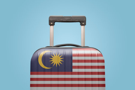 Suitcase with Malaysian flag design travel Asia concept.の写真素材