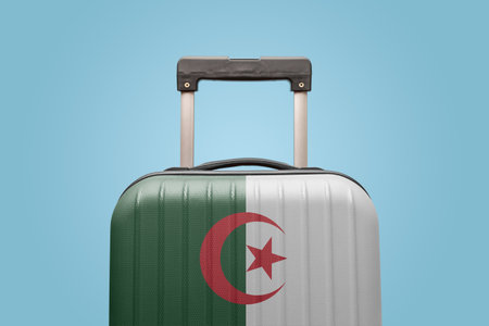 Suitcase with Algerian flag design travel Africa concept.の写真素材