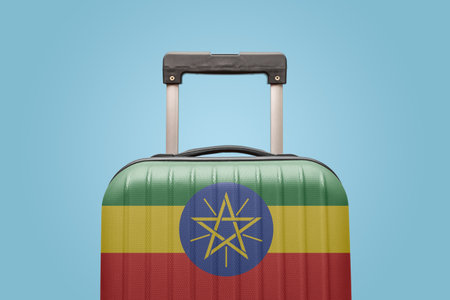 Suitcase with Ethiopian flag design travel Africa concept.の写真素材