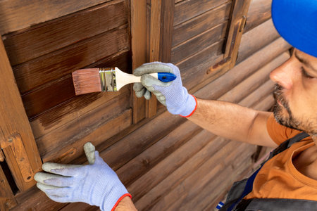Painting or staining woodwork outsideの写真素材