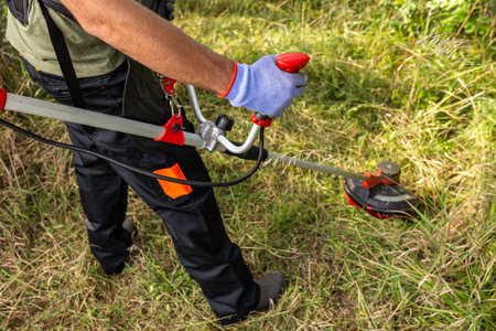 Unrecognizable man mowing the grass.の写真素材
