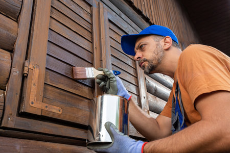 Painting or staining woodwork outsideの写真素材