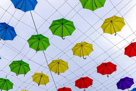 Colorful umbrellas in the sky. Street decoration in Devon, Exeter, UKの写真素材