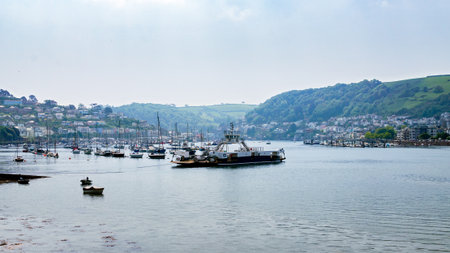 Dartmouth Devon and boats and yachts, colorful houses, hotel on Dart river on summer dayの写真素材