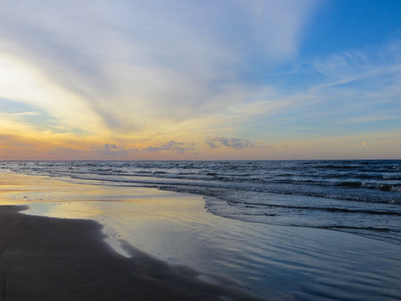 Sunset on the shore of the Gulf of Riga in Latvia.の写真素材