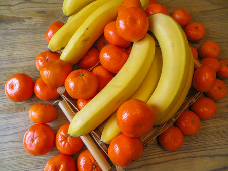 BRANCH OF SPECIAL BANANES TOGETHER WITH MAMDARINES,の写真素材