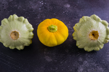 Three varicoloured patinos, yellow, green and white. Everything is grown on an organic farmの写真素材