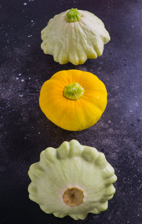 Three varicoloured patinos, yellow, green and white. Everything is grown on an organic farmの写真素材