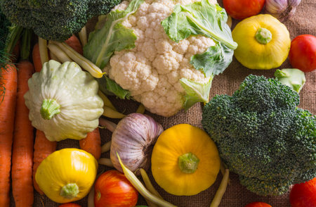 Different vegetables, small patissons, along with other vegetables, cauliflower, broccoli, garlic, cucumbers grown on an eco-farmの写真素材