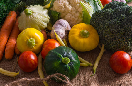 Different vegetables, small patissons, along with other vegetables, cauliflower, broccoli, garlic, cucumbers grown on an eco-farmの写真素材