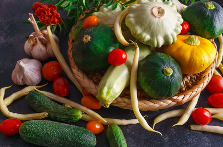 Different vegetables, small patissons, along with other vegetables, cauliflower, broccoli, garlic, cucumbers grown on an eco-farmの写真素材
