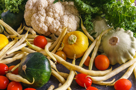 A beautiful picture of vegetables. Marrows, tomatoes,squash , cauliflower, and bean pods. Everything...