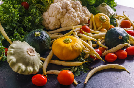 A beautiful picture of vegetables. Marrows, tomatoes,squash , cauliflower, and bean pods. Everything is grown on an organic farmの写真素材