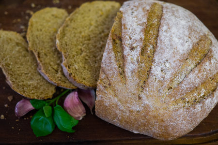 freshly baked bread on dark gray kitchen table, top view