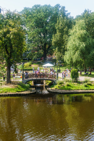 RIGA, LATVIA - August 18, 2018. People walk along the Bastion Hill on City Day