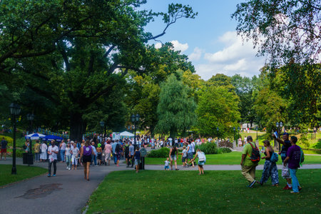 RIGA, LATVIA - August 18, 2018. People walk along the Bastion Hill on City Dayのeditorial素材