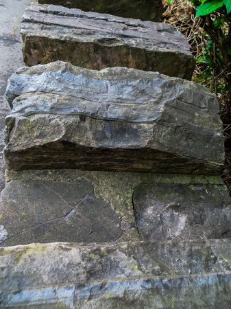 Decorative wall made of gray, rough stonesの写真素材