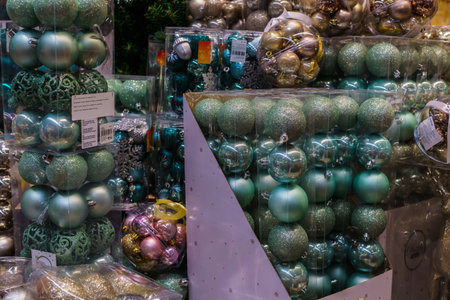 Various multicolored Christmas toys and decorations for sale in the storeのeditorial素材