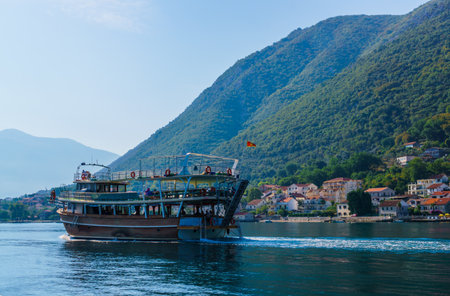Beautiful view of the shores of Kotor Bay in Montenegro. A pleasure boat for tourists. September 22,...