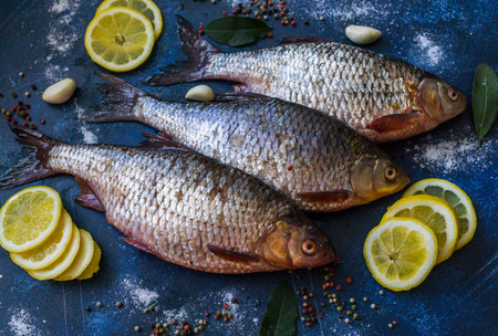 Three silver roach caught in the river, ready to be cookedの写真素材