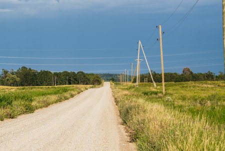 View of endless rural fields. A thunderstorm is approaching. Rural landscape in the summerの写真素材