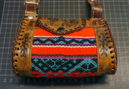 a handbag made of leather, decorated with traditional ornamentsの写真素材