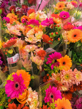 A bright bouquet of different flowers shot from above in a flower shopの写真素材