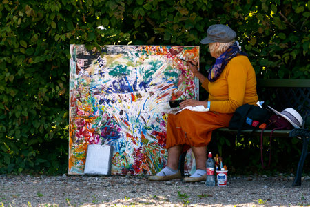An artist paints from life in the Rundale Palace park in Latvia, August 2020.のeditorial素材