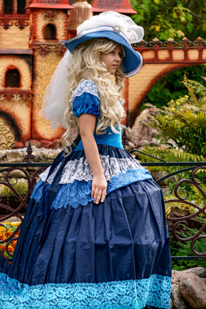 A beautiful girl dressed in a luxurious vintage blue dress.Puppet Museum, July 2020 in Preili, Latvia.のeditorial素材